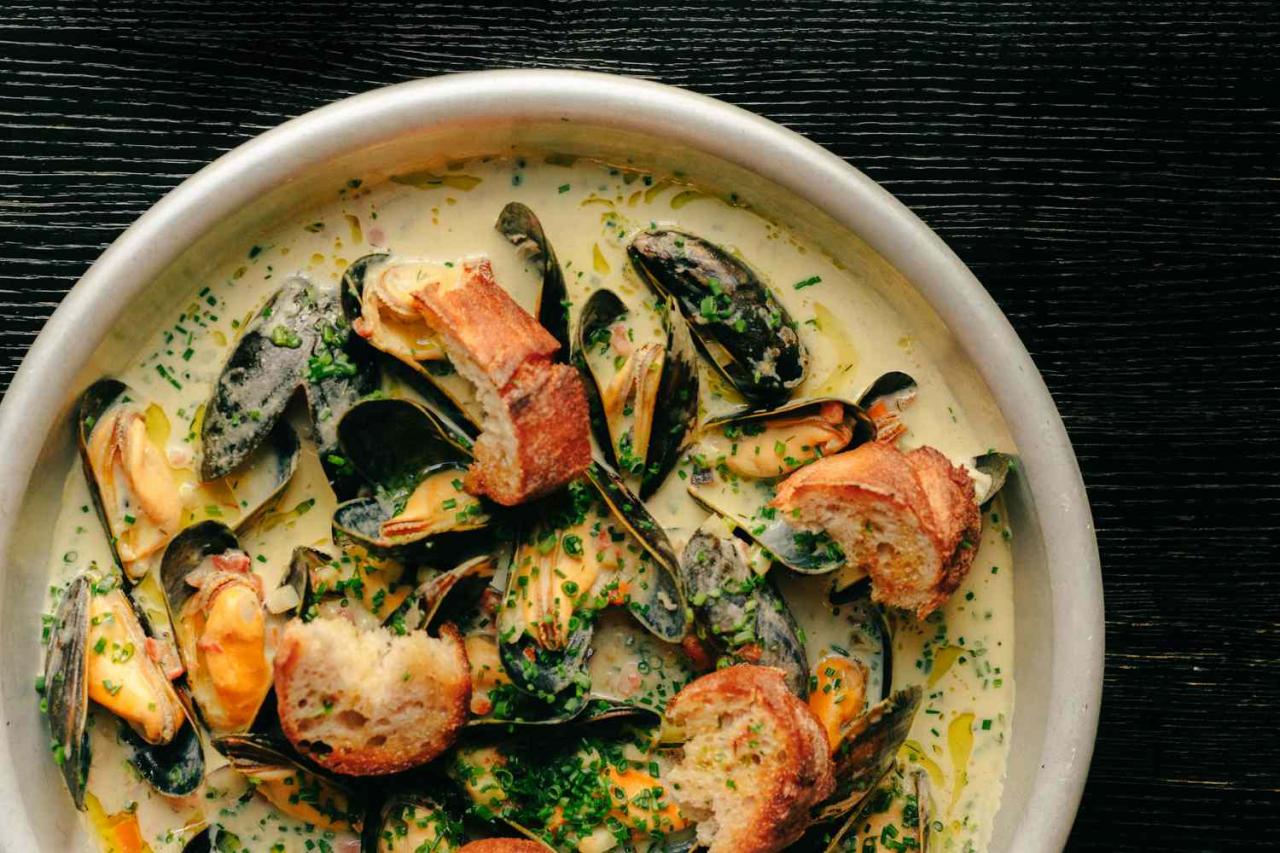 Greek-Austrian chef Konstantin Filippou serves blue mussels with a play on avgolemono (egg and lemon sauce) at his bistro O boufÃ©s